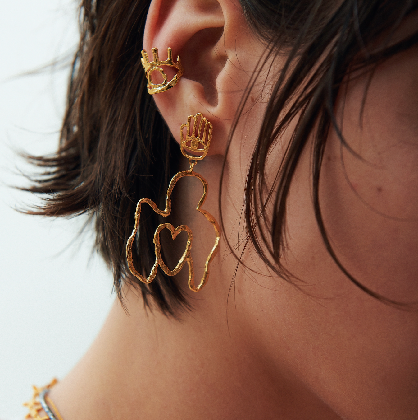 Cuerpomano earrings